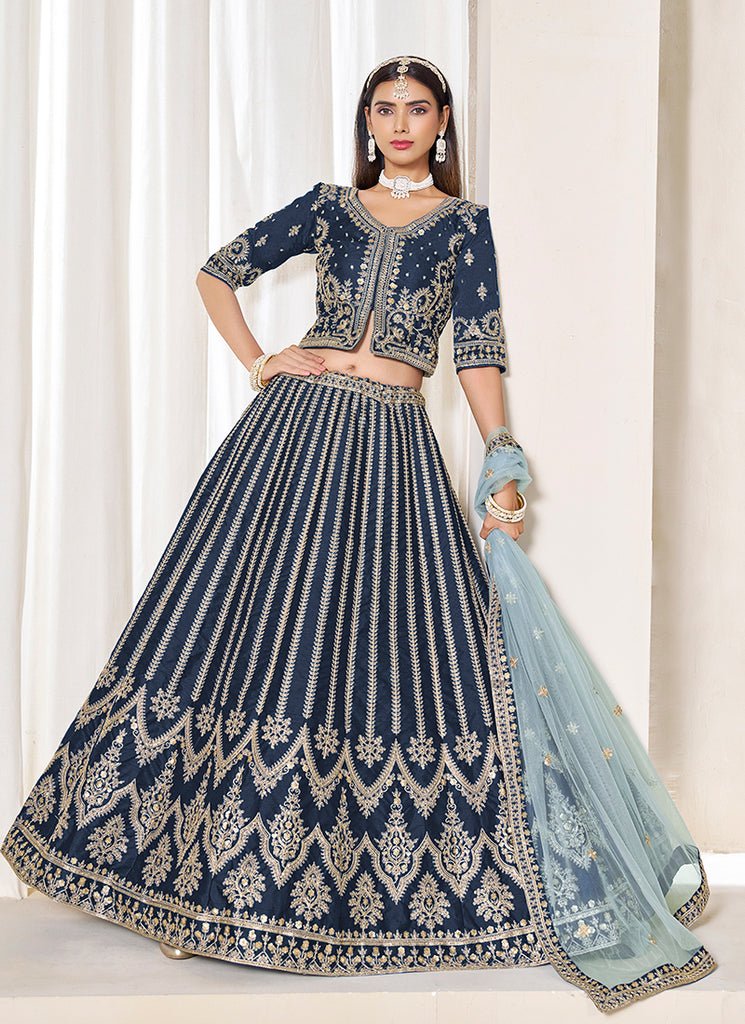 Teal Blue Heavy Embroidered Wedding Lahenga Choli.