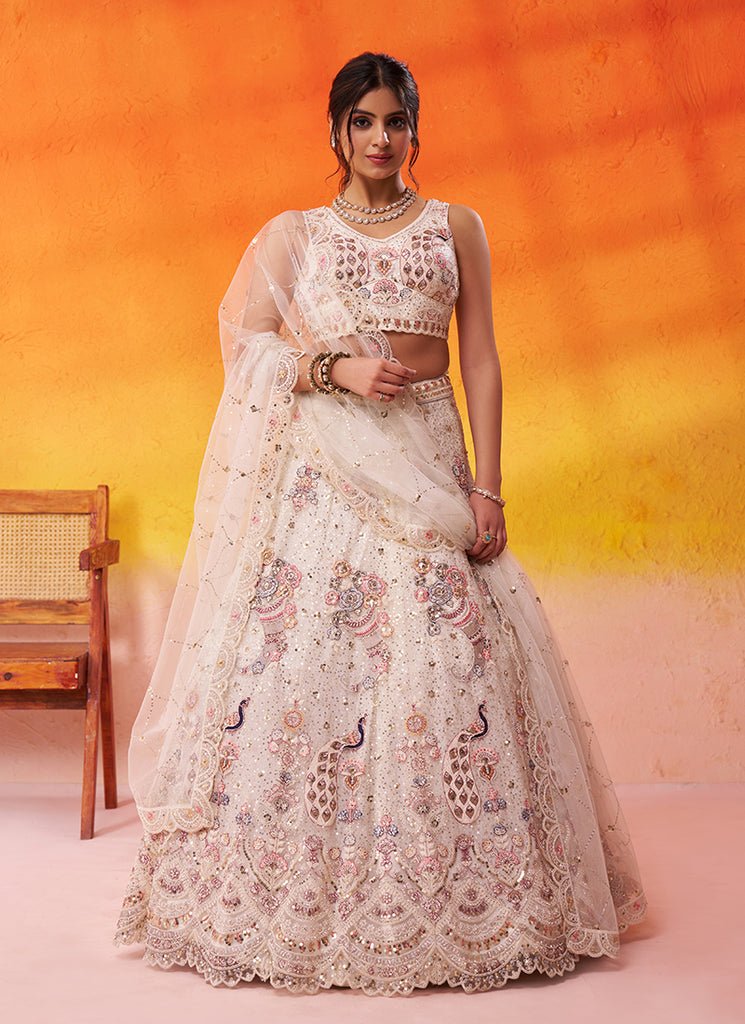 White Heavy Embroidered Wedding Lahenga Choli.