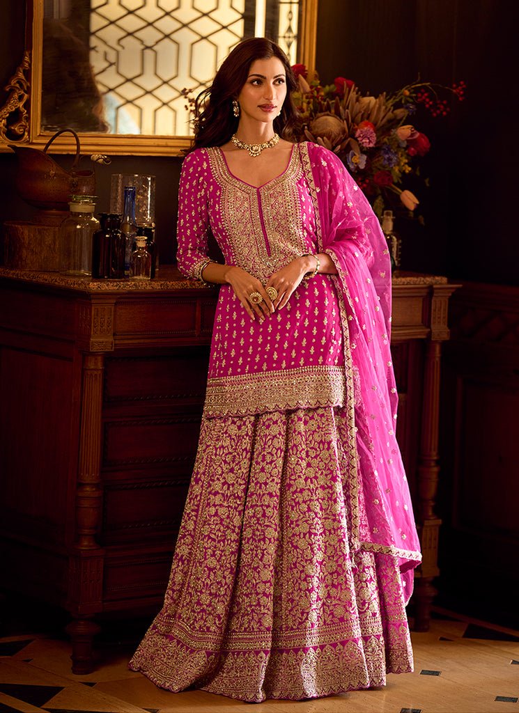 Rani Pink Heavy Embroidered Kurti And Lahenga Choli.