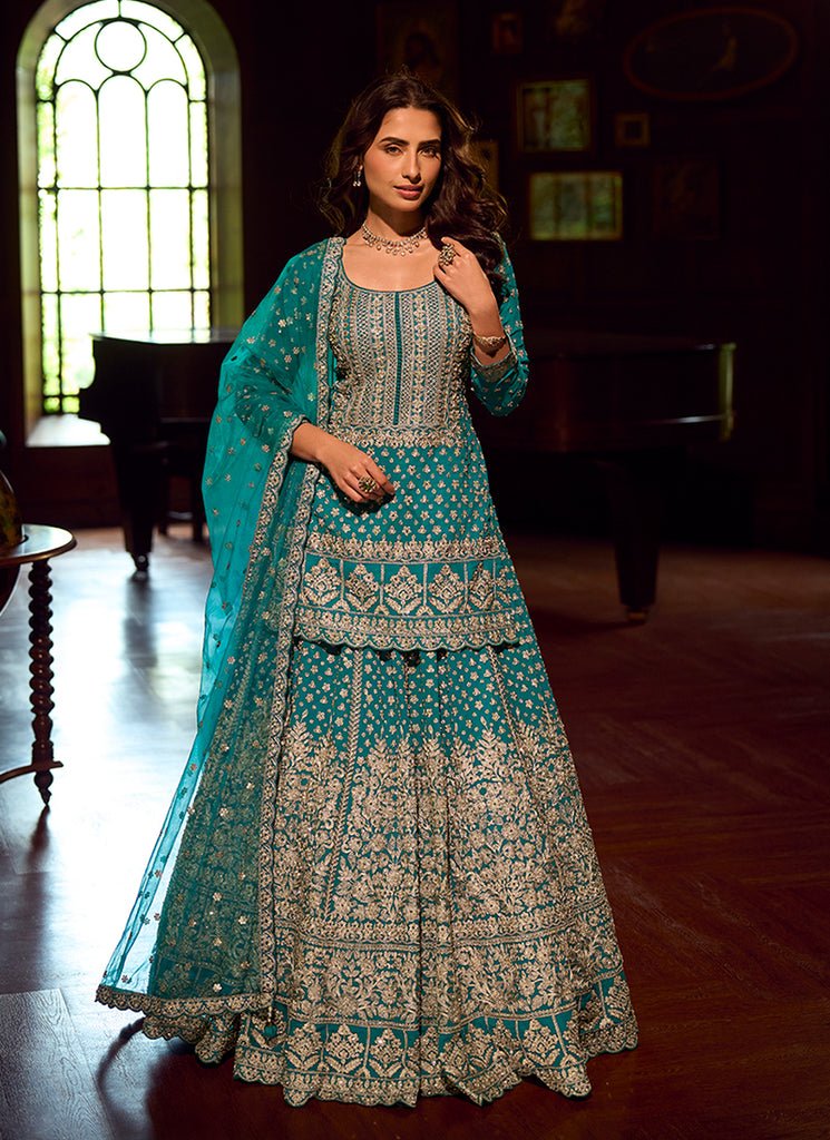 Turquoise Heavy Embroidered Kurti And Lahenga Choli.