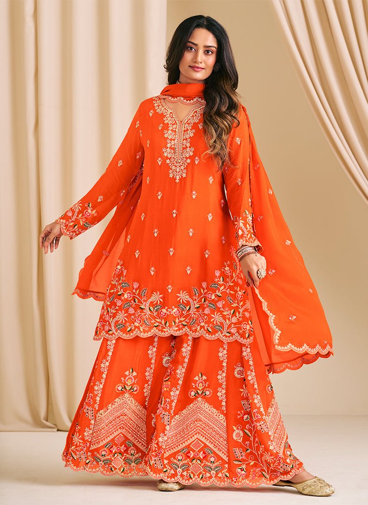 Orange Heavy Embroidered Partywear Sharara Style Dress.